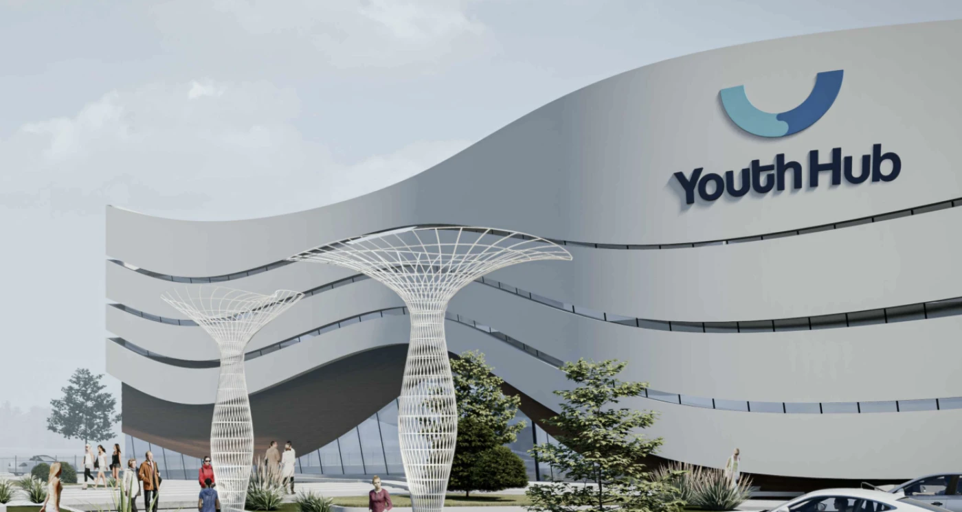 Rendering of the Youth Hub: a white building with a curved, banded facade, the Youth Hub logo and white lattice tree sculptures in the forecourt